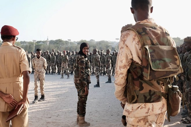 Lt. Col. Iman Elman, who is in charge of planning for the Somali National Army, overseeing troops before their deployment in anti-Shabab operations. Credit...Luca Bucken