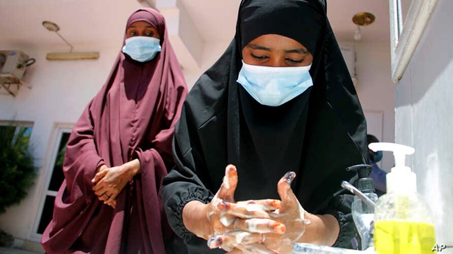 Somali females wash their hands during coronavirus awareness training conducted by local paramedics and doctors in Mogadishu, March 19, 2020. Classes in the country were shut in March to try to halt the spread of the coronavirus.