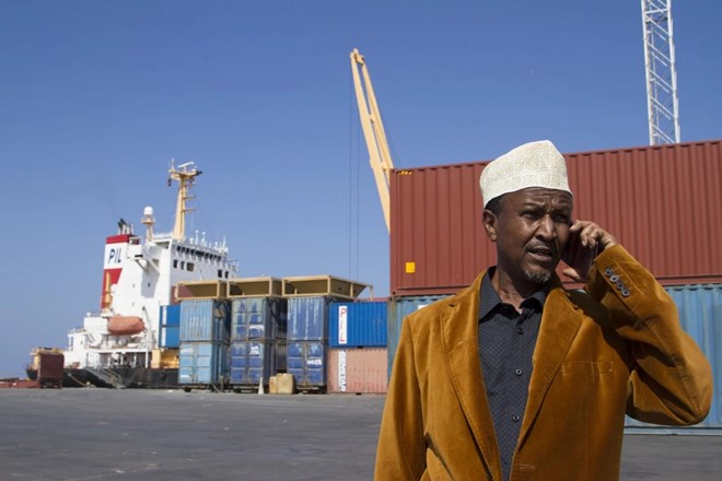 Port manager Ali Omer speaks on the phone at Berbera port in the Somaliland autonomous region of Somalia. (Paul Schemm/For The Washington Post)