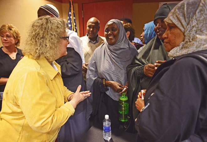 Moorhead mayor Del Rae Williams speaks with women after a meeting where the Somali Council of Elders was introduced to local Moorhead leaders and the Somali community on Saturday, Oct. 24, 2015. Rick Abbott / The Forum