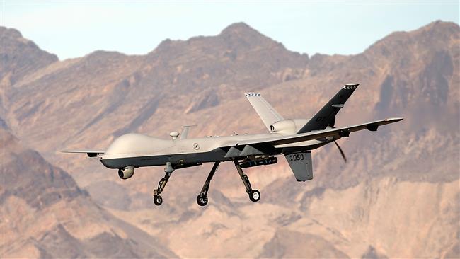 An MQ-9 Reaper remotely piloted aircraft flies by during a training mission November 17, 2015 at Creech Air Force Base in Indian Springs, Nevada. (AFP)
