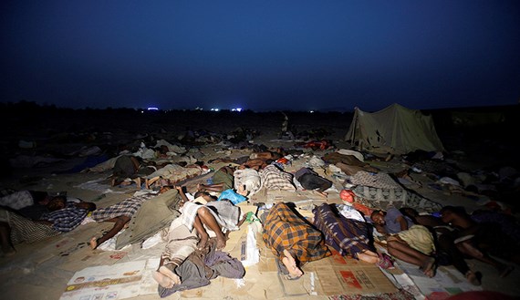 Ethiopian migrants sleep out in the open near a transit center in the western Yemeni town of Haradh, on the border with Saudi Arabia, May 21, 2013. (photo by REUTERS/Khaled Abdullah)