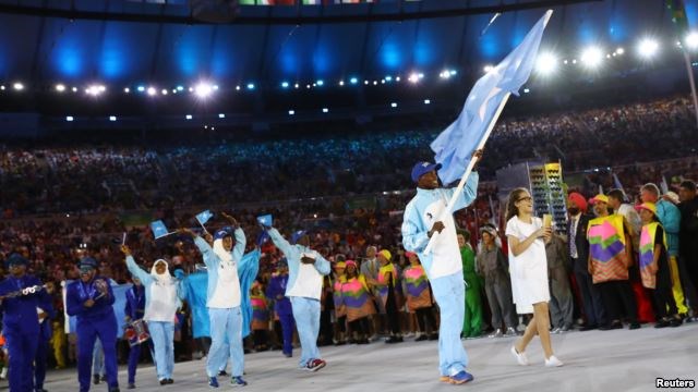 Flag-bearer Mohamed Daud Mohamed of Somalia leads his contingent during the opening ceremony at the 2016 Rio Olympics in Rio de Janeiro, Brazil, Aug. 5, 2016.