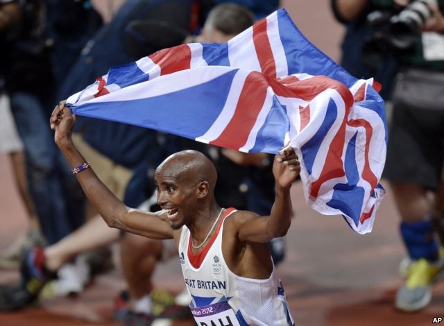 FILE - Britain's Mo Farah celebrates winning gold in the men's 10,000-meter final at Olympic Stadium at the 2012 Summer Olympics, London, Aug. 4, 2012. Farah moved to Britain as a child from his native Somalia.