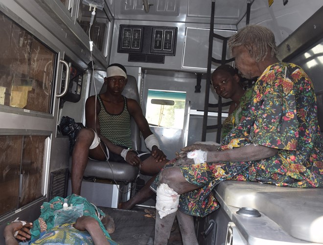 Victims of a bombing at a refugee camp received treatment on Wednesday in Maiduguri, Nigeria. JOSSY OLA / ASSOCIATED PRESS