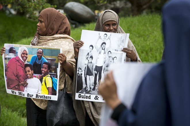 Ayan Farah, mother of Mohamed Abdihamid Farah, left, and Fadumo Hussein, mother of Guled Ali Omar, took part in a demonstration outside of the US Federal Courthouse Tuesday in support of their sons. Omar and Farah are two of the three young Somali men on trial for attempting to join ISIL.