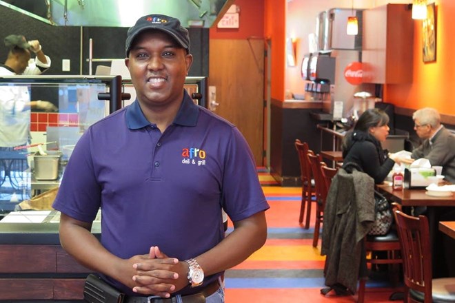 Abdirahman Kahin owns Afro Deli in Minneapolis and St. Paul, where the photo was taken. Mukhtar Ibrahim | MPR News