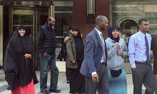 Khaalid Abdulkadir, far right, along with family and supporters, outside the U.S. District Courthouse after he was released on Tuesday. Mukhtar Ibrahim | MPR News