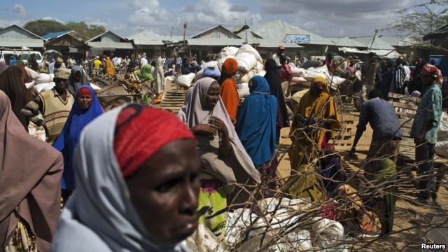 Somali refugees organize their food rations during a distribution exercise outside a U.N. World Food Program center at the Dadaab refugee settlement in Kenya, October 2013.
