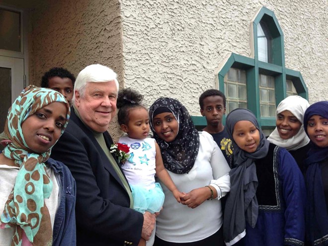 Tom Denton with some of the 10 Somali orphans he helped rescued from Saudi Arabia in January. CAROL SANDERS / WINNIPEG FREE PRESS