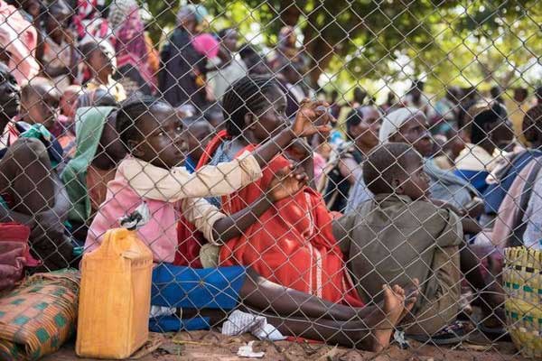 Displaced people wait for food in Wau, South Sudan, on July 3, 2016 following fighting in the area. A rights group says peacekeepers left their posts during an attack on a UN-protected site in the capital Juba by government troops. PHOTO | AFP