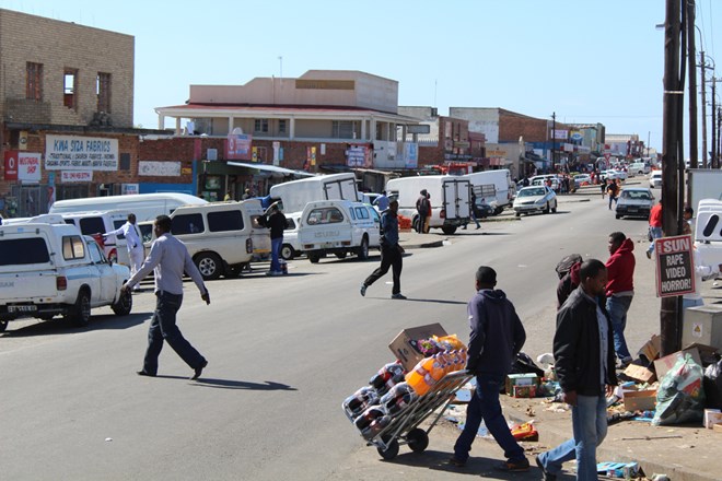 Local traders load up stock from shops on Durban Road, Korsten, Port Elizabeth. Photo: Masixole Feni