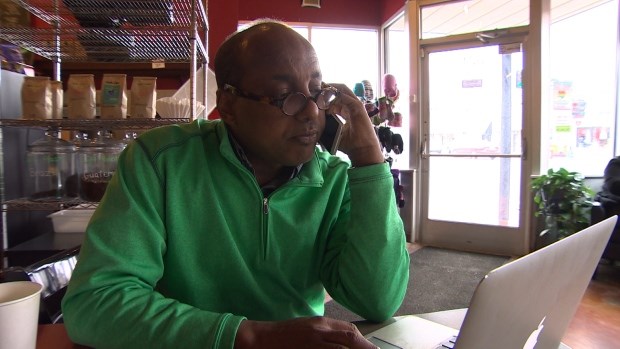 Omar Jamal, who is executive director of the Somali Community of Minnesota, often fields calls from people who are trying to sneak into Canada. (Karen Pauls/CBC)