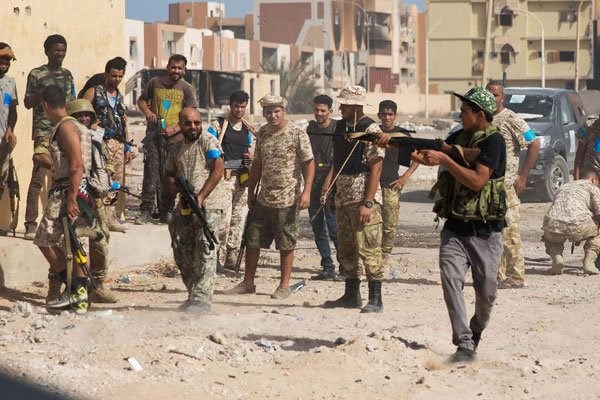 Fighters of the forces loyal to Libya's UN-backed Government of National Accord (GNA) hold a position in the coastal city of Sirte on October 27, 2016. The Libyan capital has been controlled by dozens of militias. PHOTO | AFP