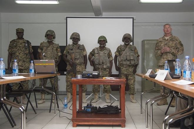Maj. Gen. Kurt Sonntag, commanding general of the Combined Joint Task Force-Horn of Africa, right, recognizes members of the Ugandan military responsible for defeating a vehicle borne IED attack while serving with the African Union Mission in Somalia during the SNA Symposium in downtown Mogadishu, Jan. 11, 2017. AMISOM is an active, regional peacekeeping mission operated by the African Union with the approval of the United Nations in Somalia.
Download full-resolution