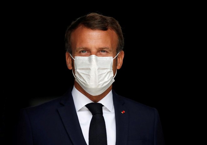 French President Emmanuel Macron, wearing a protective face mask, visits a site of pharmaceutical group Seqens, a global leader on the production of active pharmaceutical ingredients, to mobilize innovation and support the research on the coronavirus disease (COVID-19), in Villeneuve-la-Garenne, near Paris, France August 28, 2020. REUTERS/Christian Hartmann/Pool