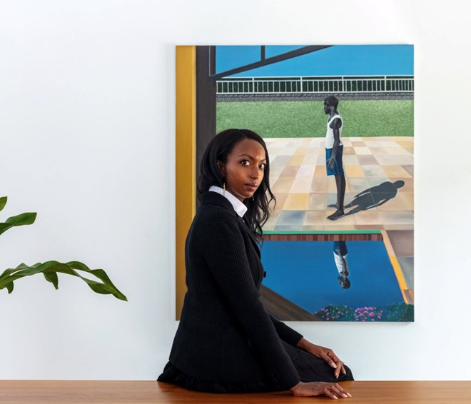 Mariane Ibrahim at her gallery in Chicago, in front of Ian Mwesiga’s Man Standing by the Pool, 2020. Ibrahim wears a Dior jacket, blouse, skirt, socks, and shoes; Almasika earrings. Photographed by Elliott Jerome Brown Jr.