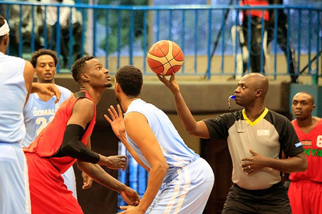 Kenya Morans' Bush Wamukota (third left) and Somalia Mohamed Naksame prepare for the start of their FIBA Afro Basket 2021 Qualifier match at Nyayo Gymnasium stadium in Nairobi on January 16, 2020. PHOTO | CHRIS OMOLLO | NATION MEDIA GROUP