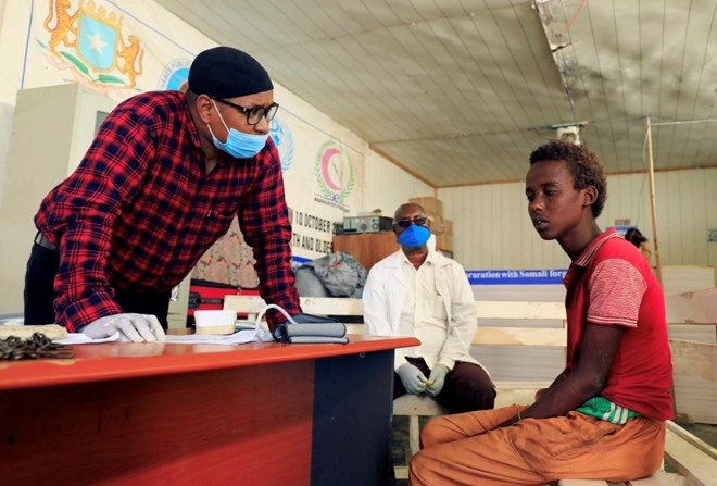 A doctor reviews a patient at the Habeeb Mental health hospital where they deal with khat addiction in Waberi district of Mogadishu, Somalia June 23, 2020. REUTERS/Feisal Omar