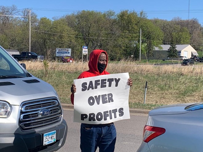 A Somali protester outside the Pilgrim Progress plant in Minnesota.GREATER MINNESOTA WORKER CENTER