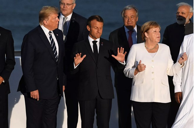 US President Donald Trump, France’s President Emmanuel Macron, and Germany’s Chancellor Angela Merkel join G7 leaders for a picture at the meeting on August 25, 2019 in Biarritz, France. Photo by Andrew Parsons - Pool/Getty Images