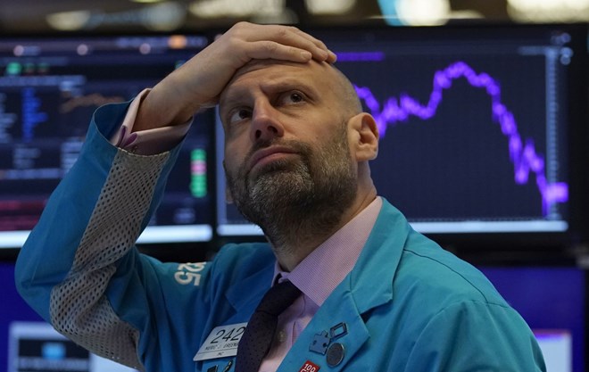 Meric Greenbaum looks up at the board before the opening bell right before trading halted on the New York Stock Exchange.TIMOTHY A. CLARY/AFP VIA GETTY IMAGES
