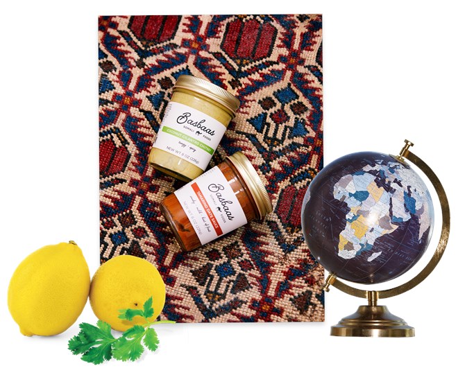 Clockwise from top: Hassan’s original Basbaas sauces; four more will join this fall. The globe is a reminder that “at my desk, the world is possible,” she says. Two ingredients in the line’s Coconut Cilantro Chutney.PHOTOGRAPHS BY KYOKO HAMADA. LEMONS AND CILANTRO: FROM GETTY IMAGES.