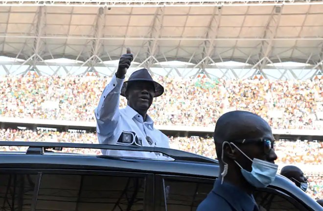 Ivorian President Alassane Ouattara gives a thumbs up to supporters Oct. 3 during the inauguration of the country’s new Olympic Stadium in Ebimpe. (Issouf Sanogo/AFP/Getty Images)