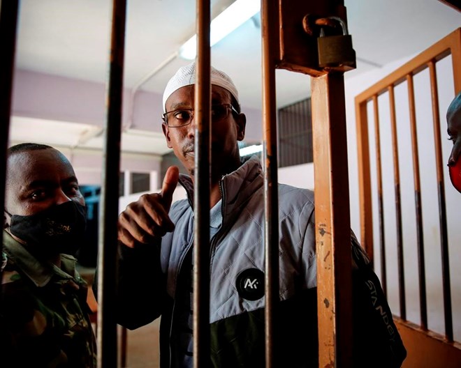 Liban Abdullah Omar, who was found innocent of supporting the gunmen involved in the Westgate Mall attack in Sept. 2013, gestures after the verdict was delivered in the trial at Milimani court in the capital Nairobi, Kenya Wednesday, Oct. 7, 2020. A Kenyan court on Wednesday found two men guilty of supporting the 2013 attack by gunmen with the Somalia-based extremist group al-Shabab on Nairobi's upscale Westgate Mall that left 67 people dead, while Chief Magistrate Francis Andayi acquitted a third suspect.  BRIAN INGANGA / AP PHOTO