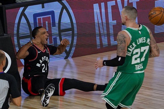 Toronto Raptors guard Norman Powell (24) celebrates after being fouled by Boston Celtics center Daniel Theis (27) during the second half of an NBA conference semifinal playoff basketball game Wednesday, Sept. 9, 2020, in Lake Buena Vista, Fla. (AP Photo/Mark J. Terrill)