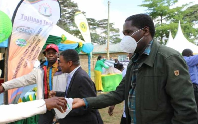 Agriculture Cabinet Secretary Peter Munya (right) and Pan Africa Climate Justice Alliance Executive Director during the launch of a sunflower farming project at Kanuni in Igembe South on September 11, 2020. [Phares Mutembei, Standard]