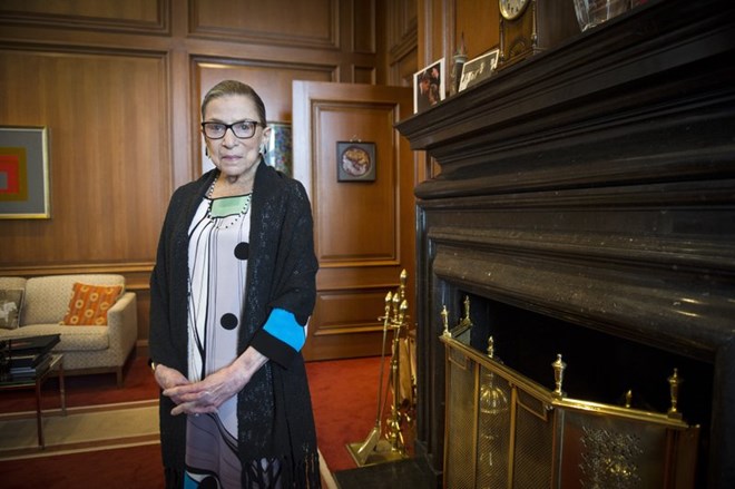 In this July 31, 2014, file photo, Associate Justice Ruth Bader Ginsburg is seen in her chambers in at the Supreme Court in Washington. The Supreme Court says Ginsburg has died of metastatic pancreatic cancer at age 87. (AP Photo/Cliff Owen, File)
