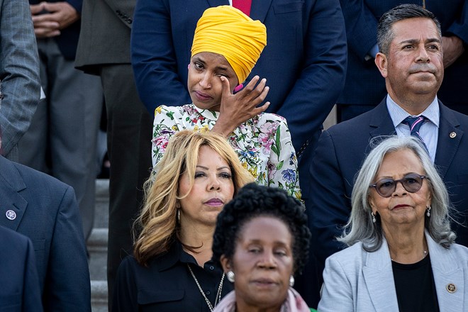 U.S. Rep. Ilhan Omar (D-MN) tears up as members of Congress hold a moment of silence for the 600,000 American lives lost to COVID-19, on the steps of the U.S. Capitol on June 14, 2021. (Photo by Drew Angerer/Getty Images)