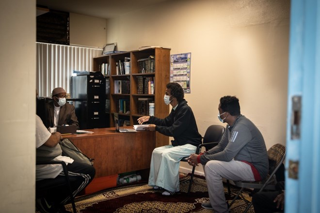 Ahmad Mahmuod helps the Huda Community Center apply for a Coronavirus Relief Loan. (Heloisa De Oliveira / For The San Diego Union-Tribune)