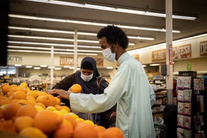 Ahmad Mahmuod’s mom helps him shop for elderly within the community.(Heloisa De Oliveira / For The San Diego Union-Tribune)