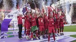 Liverpool players raise Premier League trophy in front of Klopp