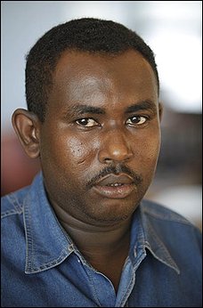 in this Tuesday, Feb. 23, 2010 picture Somali journalist Ibrahim Mohamed Hussein poses for a picture in Nairobi, Kenya. Last year Islamist insurgents blindfolded journalist Ibrahim Mohamed Hussein, tied his hands behind his back and ordered him to face Mecca. A last-second phone call spared Hussein's life. His family had paid an $18,000 ransom. After the attack Hussein fled to Uganda, leaving behind his wife and three children. He is part of an exodus of African journalists who have fled dangerous conditions in their home countries, according to a report last week by the New York-based Committee to Protect Journalists. Nine journalists were killed in Somalia last year, making the country the second deadliest in which to be a journalist, according to the CPJ report. (AP Photo/Karel Prinsloo)