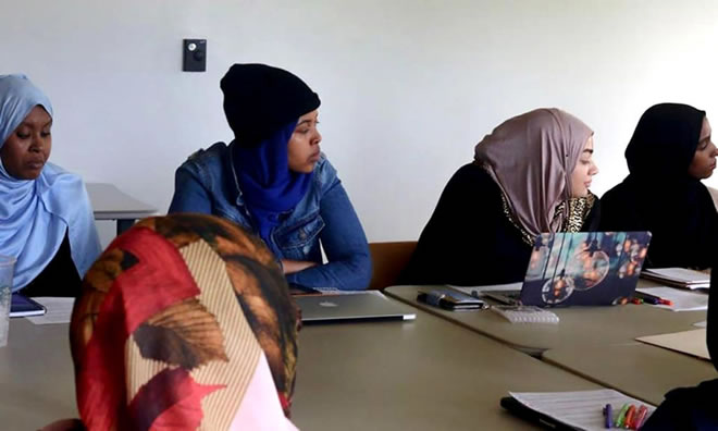 Members of the Mama Ammaan Project at a team meeting.
PHOTO FROM MUNA OSMAN