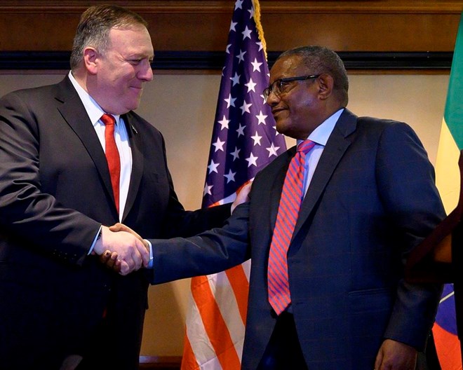 In this Tuesday, Feb. 18, 2020 file photo, U.S. Secretary of State Mike Pompeo, left, shakes hands with Ethiopia's Foreign Minister Gedu Andargachew, during a joint press conference at the Sheraton Hotel, in Addis Ababa, Ethiopia. In an interview with The Associated Press Friday, June 19, 2020, Ethiopia's Foreign Minister Gedu Andargachew declared that his country will go ahead and start filling the $4.6 billion Grand Ethiopian Renaissance Dam next month, even without an agreement with Egypt and Sudan. POOL PHOTO VIA AP, FILE / ANDREW CABALLERO-REYNOLDS