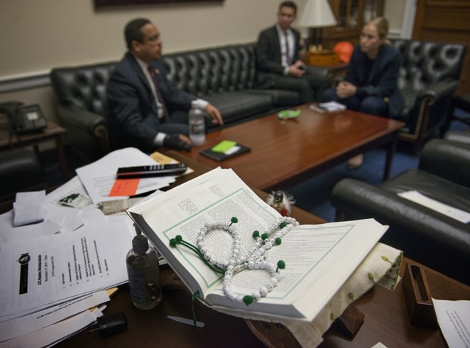 A Koran and prayer beads lay in a prominent spot on Ellison’s desk. (Photo by Linda Davidson / The Washington Post)
