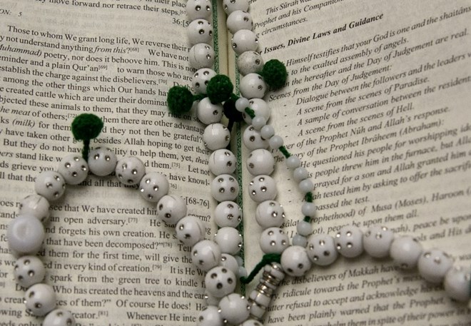 A closer look at Ellison’s Koran and prayer beads. (Photo by Linda Davidson / The Washington Post)