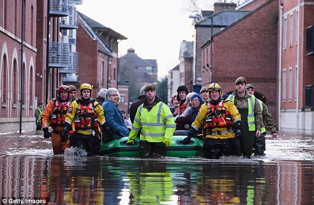 A boat full of residents were rescued from their homes in York by members of Cleveland Mountain Rescue and soldiers from the 2nd Battalion The Duke of Lancasters Regiment as rising waters engulfed homes and cars
