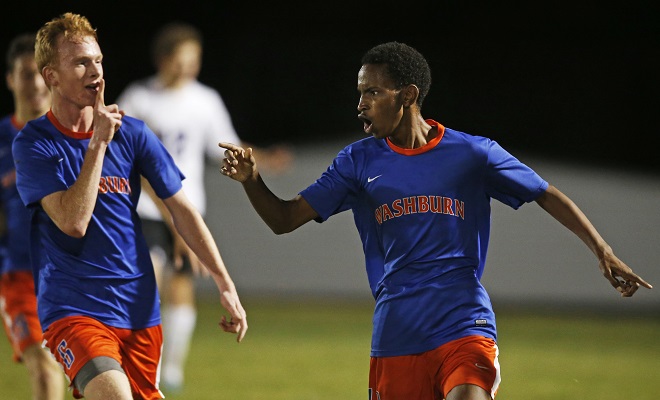 Kevin Lowen, left, rushed over to Hassan Adan after Adan scored the winning goal for Minneapolis Washburn against Southwest in a section final.