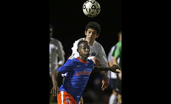 Juan Louis of Washburn tried to get control of the ball in front of Southwest’s Sam Stovitz.