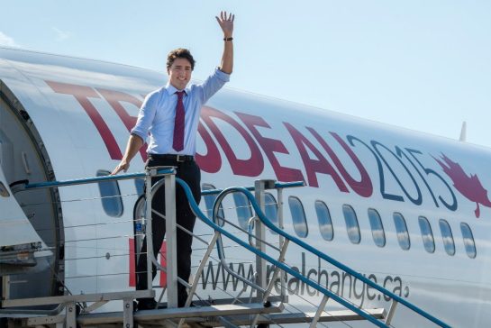 Liberal leader Justin Trudeau waves as he steps off his campaign plane arriving in Fredericton Wednesday.