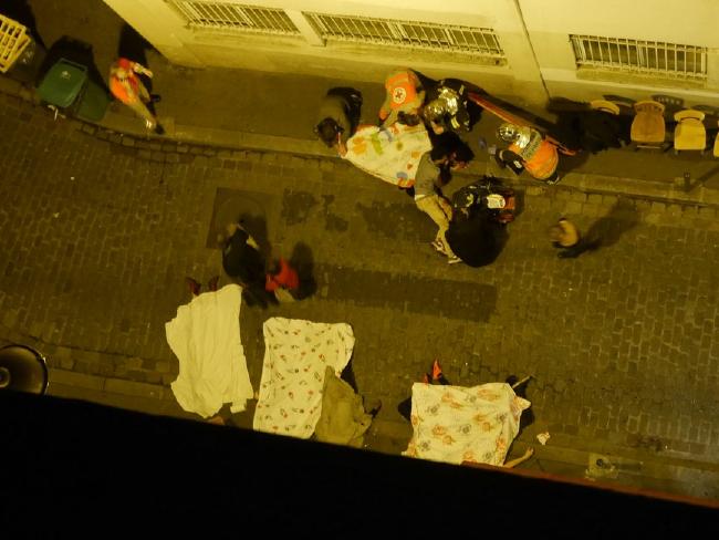 Carnage ... Victims are covered with sheets following shooting in Paris. Source: TWITTER @5h55Source:Supplied