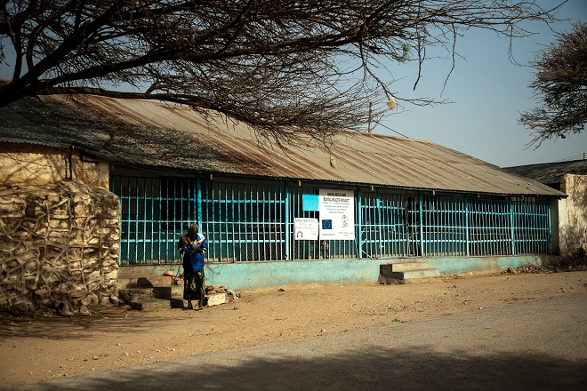 A man stands outside the mental health ward of the Hargeisa Group Hospital in the Somaliland capital, which is estimated to host around 65 male and female inpatients. [Zoe Flood/Al Jazeera]