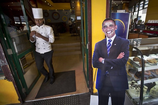 A chef walked past a cardboard cutout of President Barack Obama in the entrance of a coffee shop in Nairobi, Kenya, in July, just before the president’s visit.
