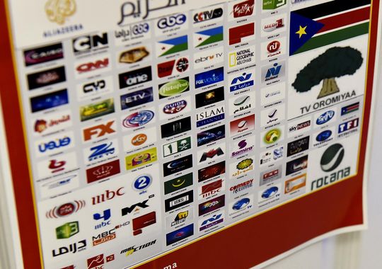 A poster lists some of the channels available through Mohamed Jama Mohamud's service in St. Cloud.