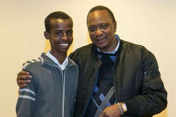 President Uhuru Kenyatta poses for a picture with one of the students under the Pupils Reward Scheme mentorship programme, who were hosted at State House, Nairobi, on Thursday night.